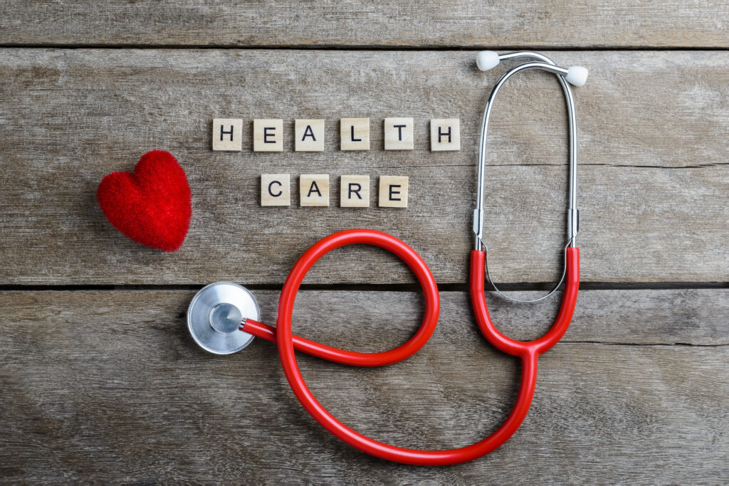 Healthcare text word made with wood blocks and Red Heart,stethos Sex Hormone Production In Men & Female